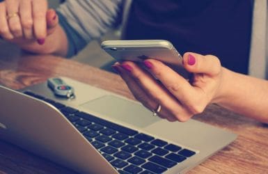 woman with smartphone and laptop