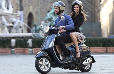 man and woman on a scooter